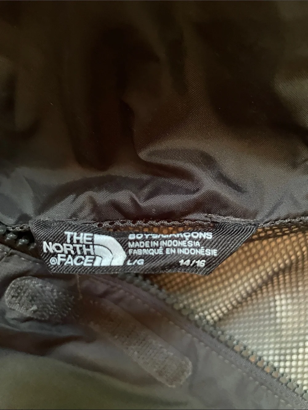 North Face hooded rain jacket. Boys size L (14/16).
